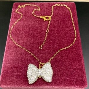 Elegant gold Tone Bow Pendant Crystals Necklace
With elegant chain NWOT